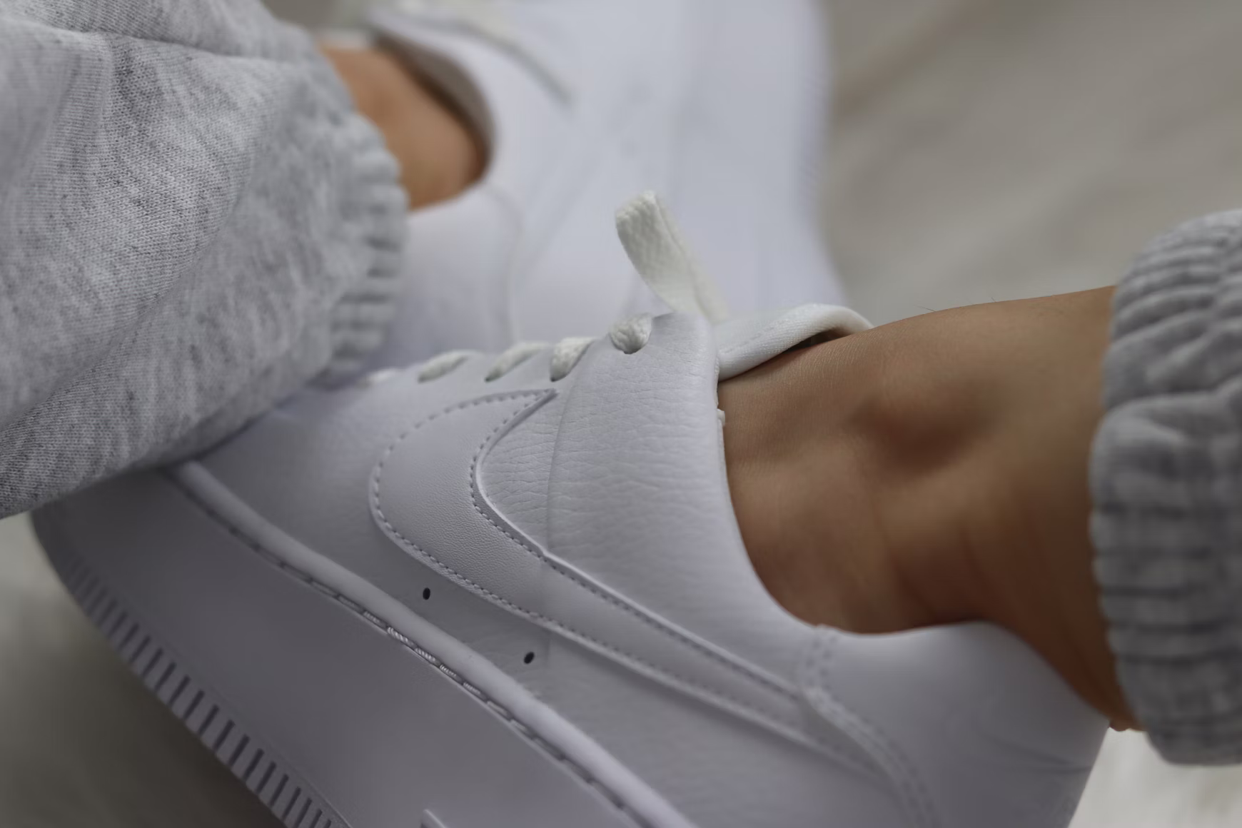 White sneakers worn regularly in the Philippines, showing dirt buildup on light-colored fabric